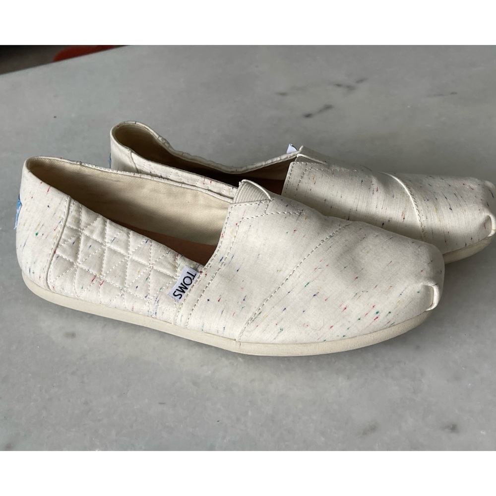 multicoloured Toms shoes